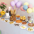 Assorted Party Food Spread With Desserts Fruits Bread Drinks And Colorful Balloons