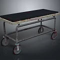 Vintage Metal Frame Furniture Cart With Black Top Surface And Rolling Wheels