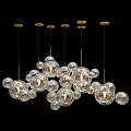 Modern Decorative Chandeliers With Transparent Glass Orbs And Golden Metal Frames