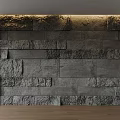 Textured Gray Stone Accent Wall With Warm Overhead Lighting In Modern Interior 3d model