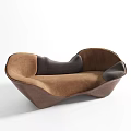 Brown Three Seater Sofa With Unique Curved Shape And Gray Cushions