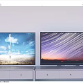 Two Televisions on White TV Stands with Scenic Displays of Sky Grass and Star Trails