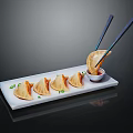 Pan Fried Dumplings Served On White Rectangular Plate With Chopsticks Dipping Sauce And Green Onions