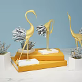 Gold And Silver Crane Decorative Ornament Set On White Bases And Orange Display Stands