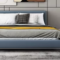 Blue Bed with White Gray Pillows Yellow Blanket Green Cabinet Decorative Paintings and Golden Light