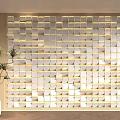 Decorative Background Wall Featuring White Square Tiles Backlit Design Wooden Surroundings And Green Plant
