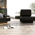 Modern Bedroom With Textured Wall Behind Bed Black Furniture White Bedding And Small Plant