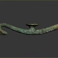 Ancient Bronze Sculpture Carving Featuring Hook Shaped Design Green Patina And Circular Decoration