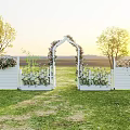 Garden Landscape Featuring White Picket Fence Arched Gate Flowers And Green Grass