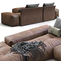 Brown Leather Sectional Sofa With Gray And Beige Pillows And Throw Blanket 3d model