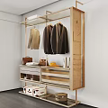 Open Wardrobe Design With Hanging Clothes Drawers Storage Baskets And Light Wood Tones