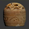 Intricate Orange Stone Sculpture Carving With Hollow Top And Decorative Patterns