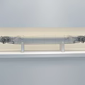 White Long Strip Decorative Ornament Set with Ornate Carved Ends and Stands on Black Base