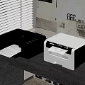Black and White Printers by Window with Blinds and Printing Paper in Home Office Setup