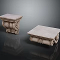 Ornamental Classical Stone Capitals With Intricate Carved Details And Square Tops