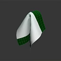 Folded White And Green Fabric Handkerchief With Shiny Reflection On Dark Background