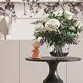 White Rose Bouquet In Clear Glass Vase With Orange Figurine On Black Round Table