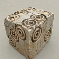 Stone Wood Cube Decorative Piece With Carved Spiral Patterns And Natural Texture