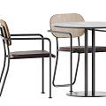 Modern Table And Chair Set With Wooden Backrests Metal Frames And Round Table Tops