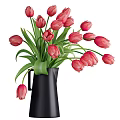 Beautiful Yellow Tulips In Black Pitcher Vase With Fresh Green Leaves