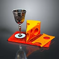 Yellow Cheese Slices with Holes on Red Mat and Silver Goblet