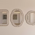 Three Decorative Mirrors with Various Shapes and Ornate Frames Hanging on Light Wall 3d model