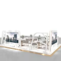 Modern Exhibition Booth With Display Screens Tables Chairs Decorative Flowers And Display Cabinets