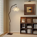 Pleated White Lampshade Floor Lamp In Cozy Room With Wooden Bookshelf And Painting