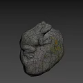 Gray Stone Frog Sculpture With Textured Surface And Yellow Spots On Natural Rock