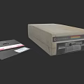 Vintage Computer Disk Drive With Floppy Disks On Dark Background 3d model