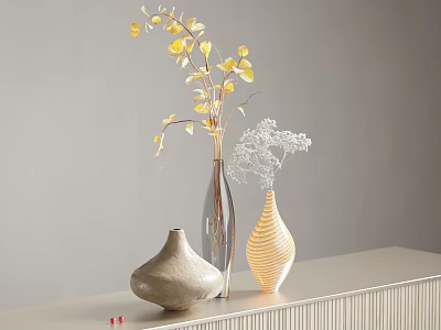 Yellow Flowers And Decorative Branches In Different Vases On Light Colored Countertop With Gray Background 3d model