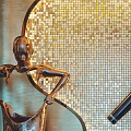 Elevator Hallway With Golden Mosaic Wall Sculpture Mirror And Red Flower Arrangement