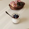 Creamy White Dessert In Glass Cup With Blueberries Berry Sauce Black Spoon And Donut Basket