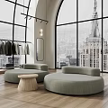 Bright Modern High End Clothing Store With Arched Windows Wood Flooring And Cozy Lounge Area