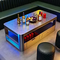Modern Silver Coffee Table With Blue Lighting Wine Bottles Fruit Platter And Wine Glasses