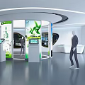 Modern Exhibition Hall Front Reception Desk With Information Screens Green Plant Elements And Circular Design