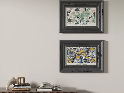 Two Framed Decorative Paintings With Floral Patterns On Wall Above Table With Books And Decor 3d model