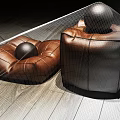 Leather Ottoman Furniture with Brown and Black Design and Decorative Balls on Wooden Floor
