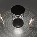 Two People Observing Black Cylindrical Structure With Surrounding Text And Light 3d model