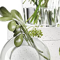 Decorative Glass Vases With Green Plants And Spherical Blooms On White Pedestal