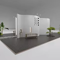 Modern Exhibition Booth with White Curved Walls Green Plants Dark Floor and Display Furniture