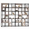 Modern Decorative Shelf Unit with Black Frame and White Shelves Displaying Vases Sculptures Plants