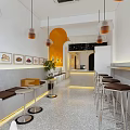 Modern Milk Tea Shop Interior With Open Bar Counter Hanging Lamps And Orange Accents