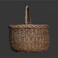 Sweet Little Kitten Resting Inside Brown Woven Basket On Black Background