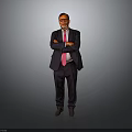 A Man In Black Suit With Pink Tie Standing With Crossed Arms On Gray Background