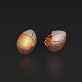Cracked Egg With Glowing Orange Light Inside Split Shell On Dark Surface 3d model