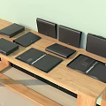 Black Storage Cases In Various Styles And Sizes Arranged On Wooden Table 3d model