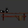 Red Wooden Bench With Two Black Oil Lamps And Brown Watering Can