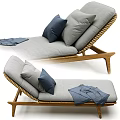 Comfortable Lounge Chair With Wooden Frame Rattan Backrest Gray Cushion Blue Pillow And Gray Blanket
