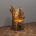 Golden Modern Accent Chair With Unique Shape On Herringbone Wooden Floor